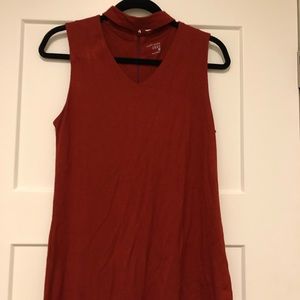 Younkers:  around the neck, orange shirt